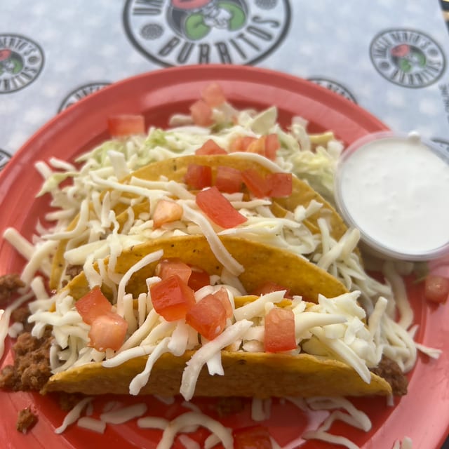 FOUR CRUNCHY BEEF TACOS, CHIPS N BEANS.