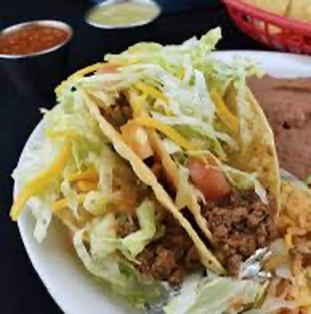 TEN CRUNCHY BEEF TACOS, 2 Chips, 2 Beans.