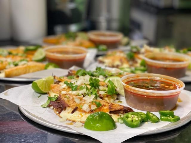 THREE SHREDDED BEEF QUESABIRRIA TACOS.
