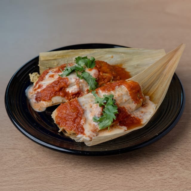 2 Smothered Tamales.